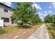 The spacious backyard with lush landscaping offers serene views of the surrounding green spaces at 1209 Payne Stewart Dr, Davenport, FL 33896