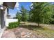 Private brick-paved backyard with lush landscaping and scenic walking path in a pet-friendly community at 1209 Payne Stewart Dr, Davenport, FL 33896
