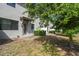 Backyard has a patio area and is shaded by mature tree at 1209 Payne Stewart Dr, Davenport, FL 33896