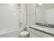 Bathroom featuring a tub and shower combination and modern vanity at 1209 Payne Stewart Dr, Davenport, FL 33896