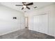Bedroom features neutral carpet, ceiling fan, and a closet at 1209 Payne Stewart Dr, Davenport, FL 33896