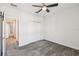 Bright bedroom featuring plush gray carpet, ceiling fan, and a spacious closet at 1209 Payne Stewart Dr, Davenport, FL 33896