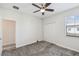 Comfortable bedroom featuring neutral carpet, closet, ceiling fan, and window at 1209 Payne Stewart Dr, Davenport, FL 33896