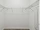 White walk-in closet with wire shelving for organized storage space at 1209 Payne Stewart Dr, Davenport, FL 33896