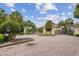 Elegant gated community entrance with lush landscaping and welcoming signage for a secure and prestigious living at 1209 Payne Stewart Dr, Davenport, FL 33896