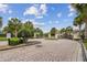Inviting gated community entrance with lush landscaping, ensures privacy and exclusivity for residents and guests at 1209 Payne Stewart Dr, Davenport, FL 33896