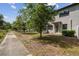 Charming two-story townhome with manicured front yard and inviting entrance, perfect for a growing Gathering at 1209 Payne Stewart Dr, Davenport, FL 33896