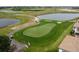 Scenic golf course view showcasing lush green lawns and well-manicured putting greens on a sunny day at 1209 Payne Stewart Dr, Davenport, FL 33896