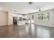 Bright kitchen features stainless appliances, an island, and views of the dining area at 1209 Payne Stewart Dr, Davenport, FL 33896