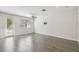 Bright living area with a sliding door and access to an outdoor space at 1209 Payne Stewart Dr, Davenport, FL 33896