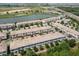 Aerial view of the beautiful townhomes with well-maintained landscaping in a desirable community at 1209 Payne Stewart Dr, Davenport, FL 33896
