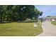 Expansive front yard with mature trees and the home in the background at 6975 Sw 99Th St, Ocala, FL 34476