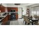 Well-equipped kitchen featuring stainless steel appliances, abundant counter space, and tile flooring at 6975 Sw 99Th St, Ocala, FL 34476
