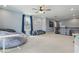 Spacious bonus room with carpeted floors, a bean bag, and ample natural light at 12243 Sawgrass Reserve Blvd, Orlando, FL 32824
