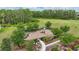 Aerial shot of a community park with a playground and walking path, nestled among mature trees at 12243 Sawgrass Reserve Blvd, Orlando, FL 32824