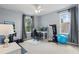 Bright office with a desk, computer setup, and workout equipment near the windows at 12243 Sawgrass Reserve Blvd, Orlando, FL 32824