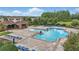 This beautiful pool features many chairs and umbrellas for lounging at 12243 Sawgrass Reserve Blvd, Orlando, FL 32824