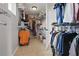 Walk-in closet with organized storage, shelving, and hanging space for clothing at 12243 Sawgrass Reserve Blvd, Orlando, FL 32824