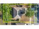 Bird's eye view of the house and surrounding landscaping with a large lot at 1472 Muir Cir, Clermont, FL 34711
