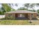 Rear view of the home highlighting the patio, fountain, and backyard at 1472 Muir Cir, Clermont, FL 34711