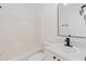 Bright bathroom featuring a vanity and a shower/tub combo at 1472 Muir Cir, Clermont, FL 34711