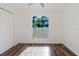 Bright bedroom with luxury vinyl plank flooring and a large window at 1472 Muir Cir, Clermont, FL 34711