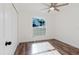 Bright bedroom with luxury vinyl plank flooring, a ceiling fan and a closet at 1472 Muir Cir, Clermont, FL 34711