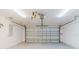 Spacious garage with white walls and a large, functional garage door at 1472 Muir Cir, Clermont, FL 34711