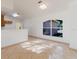 Open living room with tile flooring and view to kitchen at 1472 Muir Cir, Clermont, FL 34711