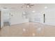 Spacious living room with tile floors, ceiling fan, and ample natural light at 1472 Muir Cir, Clermont, FL 34711