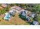 Aerial view of community amenities, including pool and tennis courts, surrounded by lush landscaping at 337 Scottsdale Sq # 337, Winter Park, FL 32792