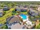 Aerial view of condo community and pool featuring beautifully maintained landscaping and amenities at 337 Scottsdale Sq # 337, Winter Park, FL 32792