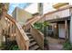 The exterior shows an entrance accessible by stairs, mature landscaping, and a well-lit walkway at 337 Scottsdale Sq # 337, Winter Park, FL 32792