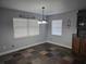 Bright dining area with natural light, stylish light fixture, and decorative wall accents at 4506 Se 7Th Pl, Ocala, FL 34471
