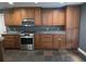 Well-equipped kitchen with custom wood cabinetry, granite countertops, and stainless steel appliances at 4506 Se 7Th Pl, Ocala, FL 34471