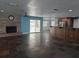 Open living room featuring a brick fireplace, and an adjacent dining and kitchen area at 4506 Se 7Th Pl, Ocala, FL 34471