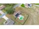 Aerial view of a house featuring a private pool, fenced yard, and solar panels at 14791 Sw 29Th Avenue Rd, Ocala, FL 34473