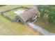 Aerial view of a cozy home with a fenced backyard, private pool, and solar panels at 14791 Sw 29Th Avenue Rd, Ocala, FL 34473
