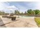 Backyard features a fenced-in yard, a pool, and patio furniture at 14791 Sw 29Th Avenue Rd, Ocala, FL 34473
