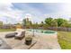 Private backyard with an inviting in-ground pool and comfortable patio seating area at 14791 Sw 29Th Avenue Rd, Ocala, FL 34473