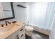 Bathroom features a shower, toilet, vanity, and mirror at 14791 Sw 29Th Avenue Rd, Ocala, FL 34473