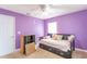 Bright bedroom featuring a daybed, shelves, and natural light from a window at 14791 Sw 29Th Avenue Rd, Ocala, FL 34473