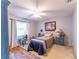 Bedroom featuring carpet, ceiling fan, and an art decor at 14791 Sw 29Th Avenue Rd, Ocala, FL 34473
