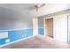 Bedroom with a double door closet featuring ceiling fan at 14791 Sw 29Th Avenue Rd, Ocala, FL 34473