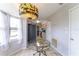View of eat-in kitchen and adjacent breakfast nook with stylish chandelier at 14791 Sw 29Th Avenue Rd, Ocala, FL 34473