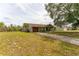 Inviting single-story home with a cozy front yard, featuring a convenient attached garage at 14791 Sw 29Th Avenue Rd, Ocala, FL 34473