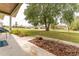 Well-manicured front yard with flower beds and a mature shade tree providing curb appeal at 14791 Sw 29Th Avenue Rd, Ocala, FL 34473