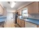 View of the kitchen sink, refrigerator, and adjacent breakfast nook at 14791 Sw 29Th Avenue Rd, Ocala, FL 34473