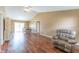 Spacious living room featuring vaulted ceilings, wood floors, and a comfortable recliner at 14791 Sw 29Th Avenue Rd, Ocala, FL 34473