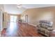 Spacious living room featuring vaulted ceilings, wood floors, and a comfortable recliner at 14791 Sw 29Th Avenue Rd, Ocala, FL 34473